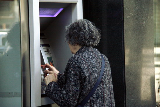 A customer using an ATM 