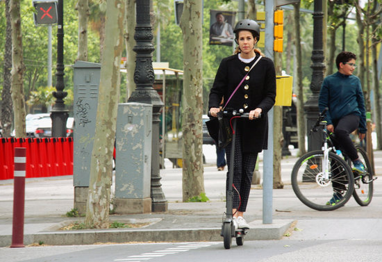 A woman on an electric scooter in Barcelona's Avinguda Diagonal on May 21, 2019