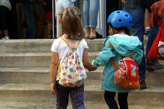 Two students enter a school in Barcelona