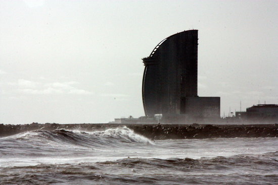 Large waves at Barceloneta beach with W Barcelona hotel in the background, January 23, 2020