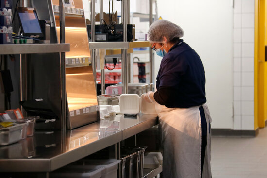 A worker prepares food in the 'Not So Dark' ghost kitchen on March 23, 2021