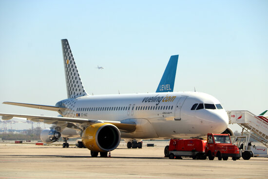 A Vueling airplane in front of a Level airline plane landed in Barcelona airport on March 24, 2021