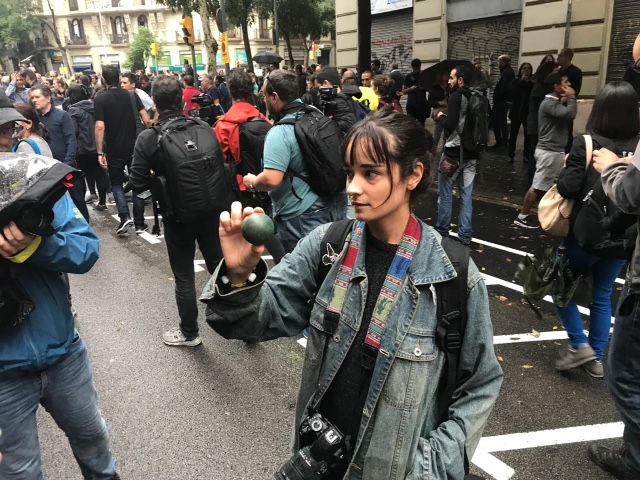 A woman shows a rubber bullet fired by the Catalan police Mossos d'Esquadra in Barcelona on October 1, 2017.