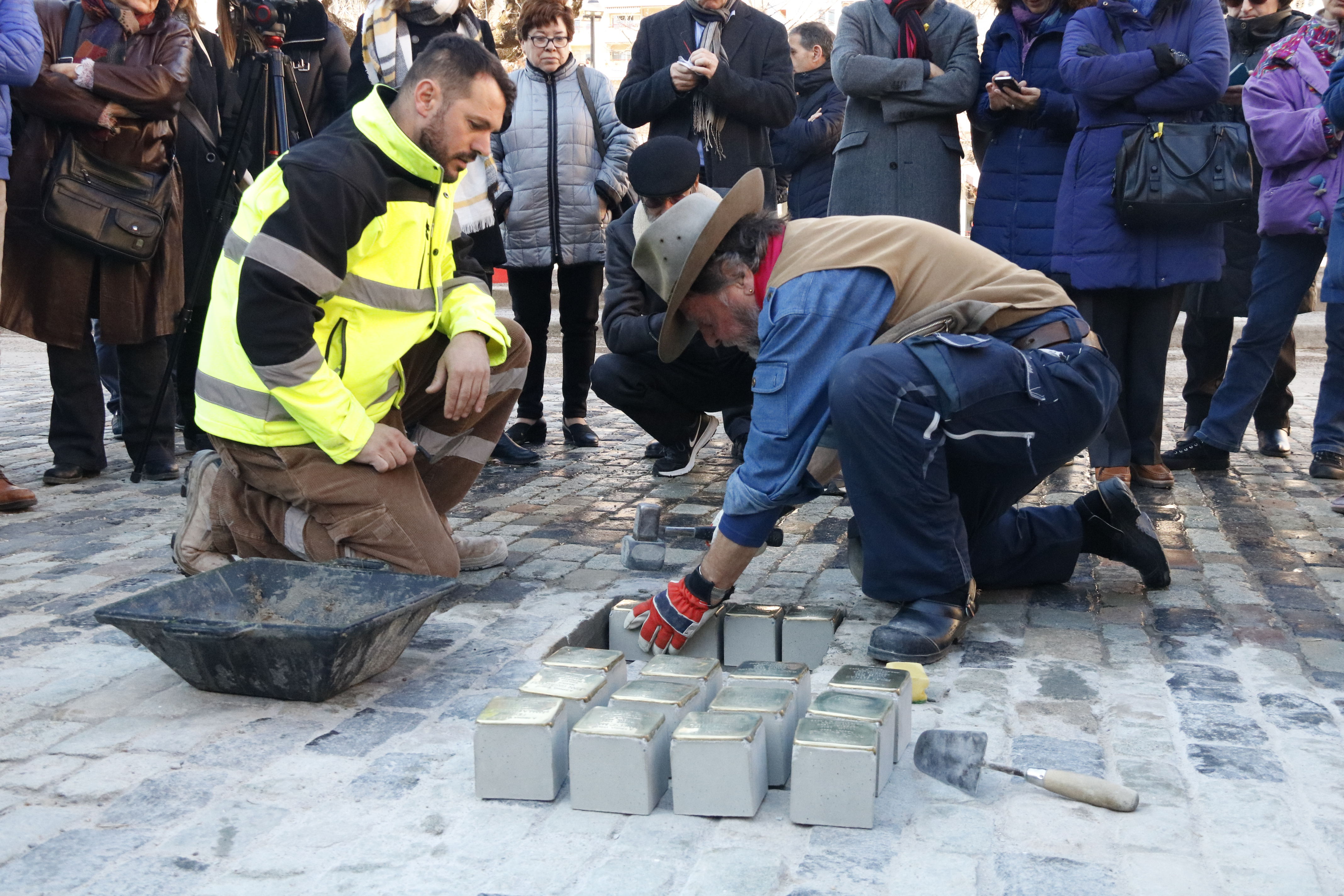 Artist Günter Demnig placing Stolpesteine in Girona in 2018