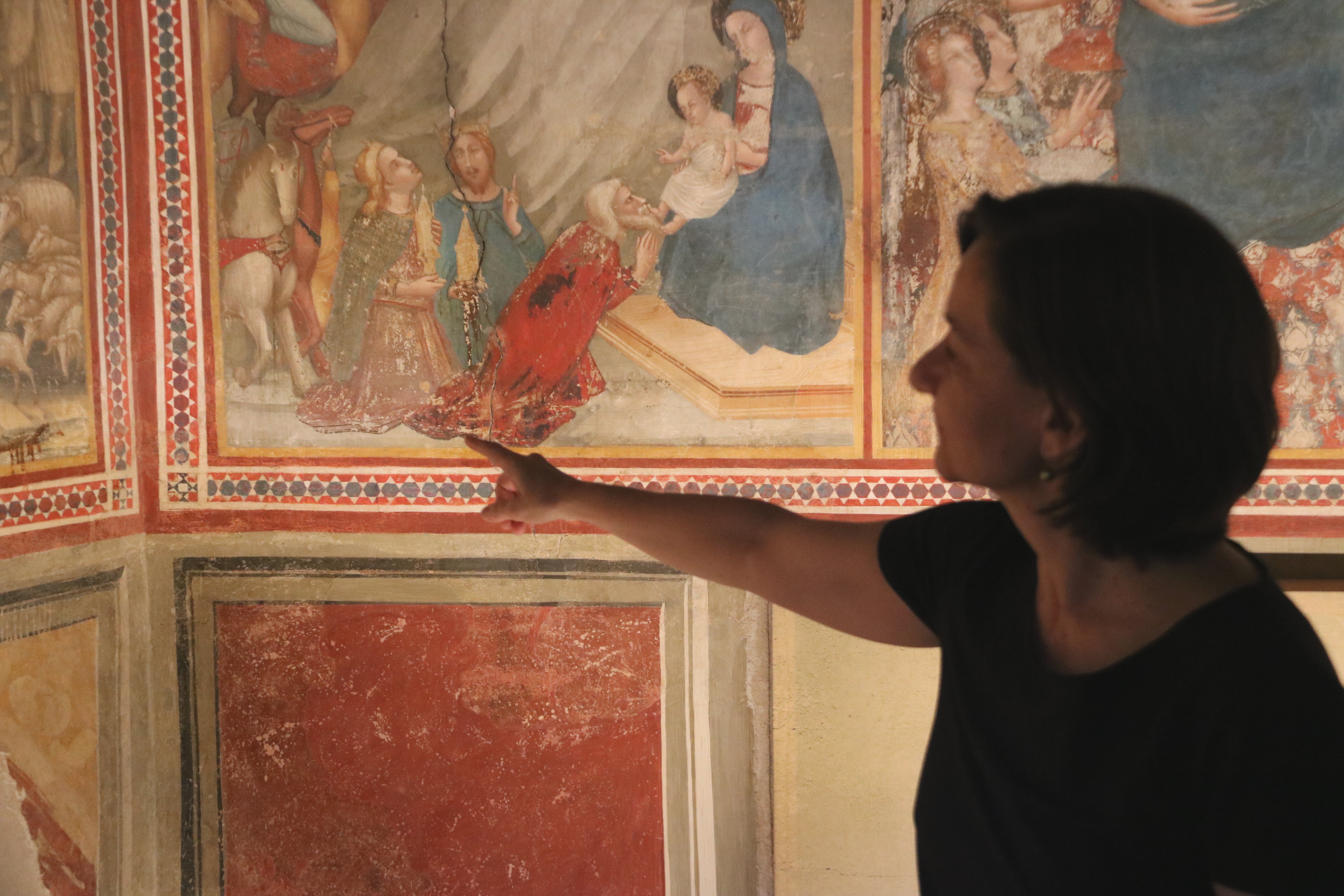 A technician shows part of the Gothic art restoration of the Pedralbes Monastery's Sant Miquel chapel on June 21, 2018