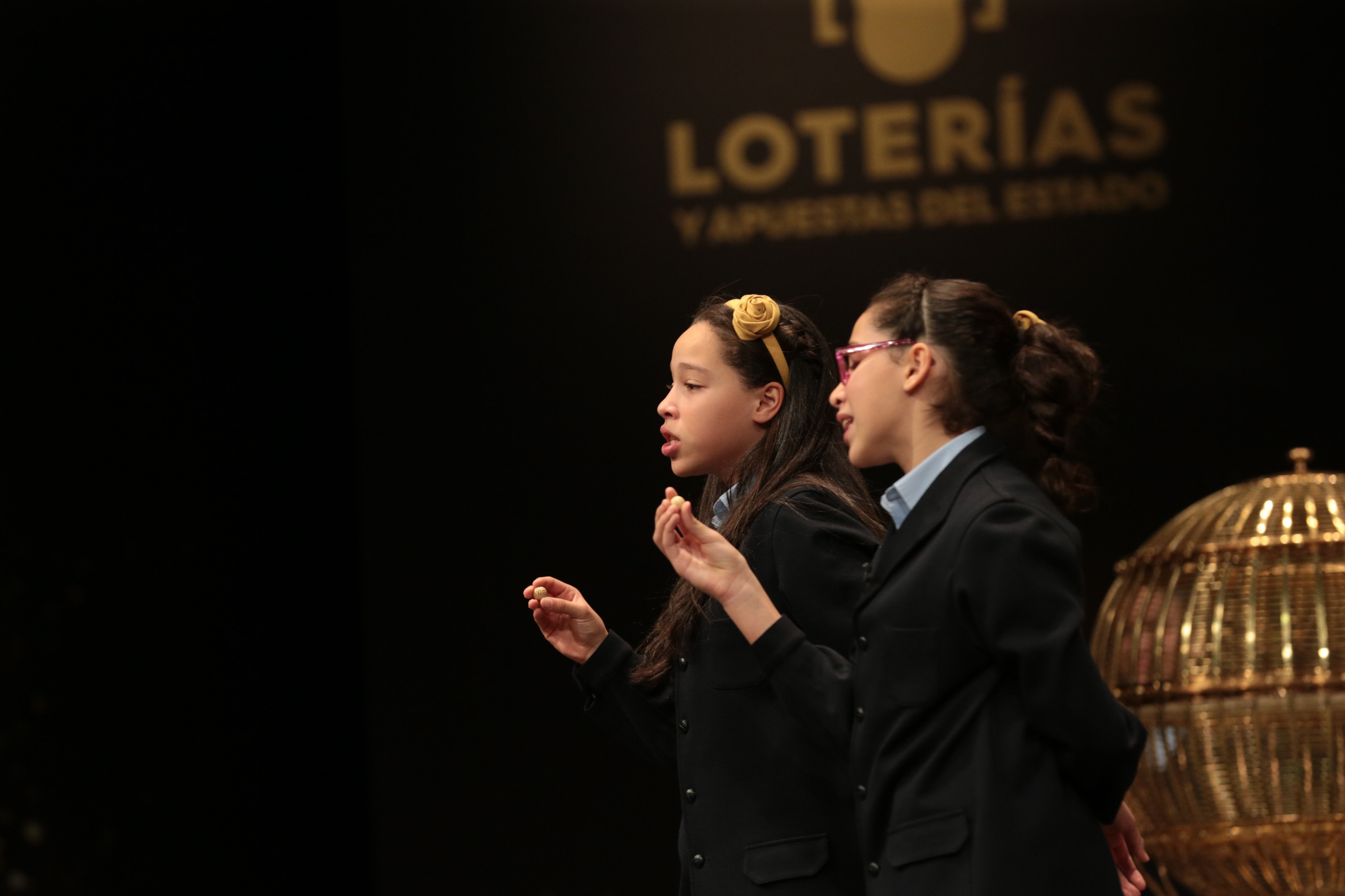 San Ildefonso children sing the lottery numbers during the raffle