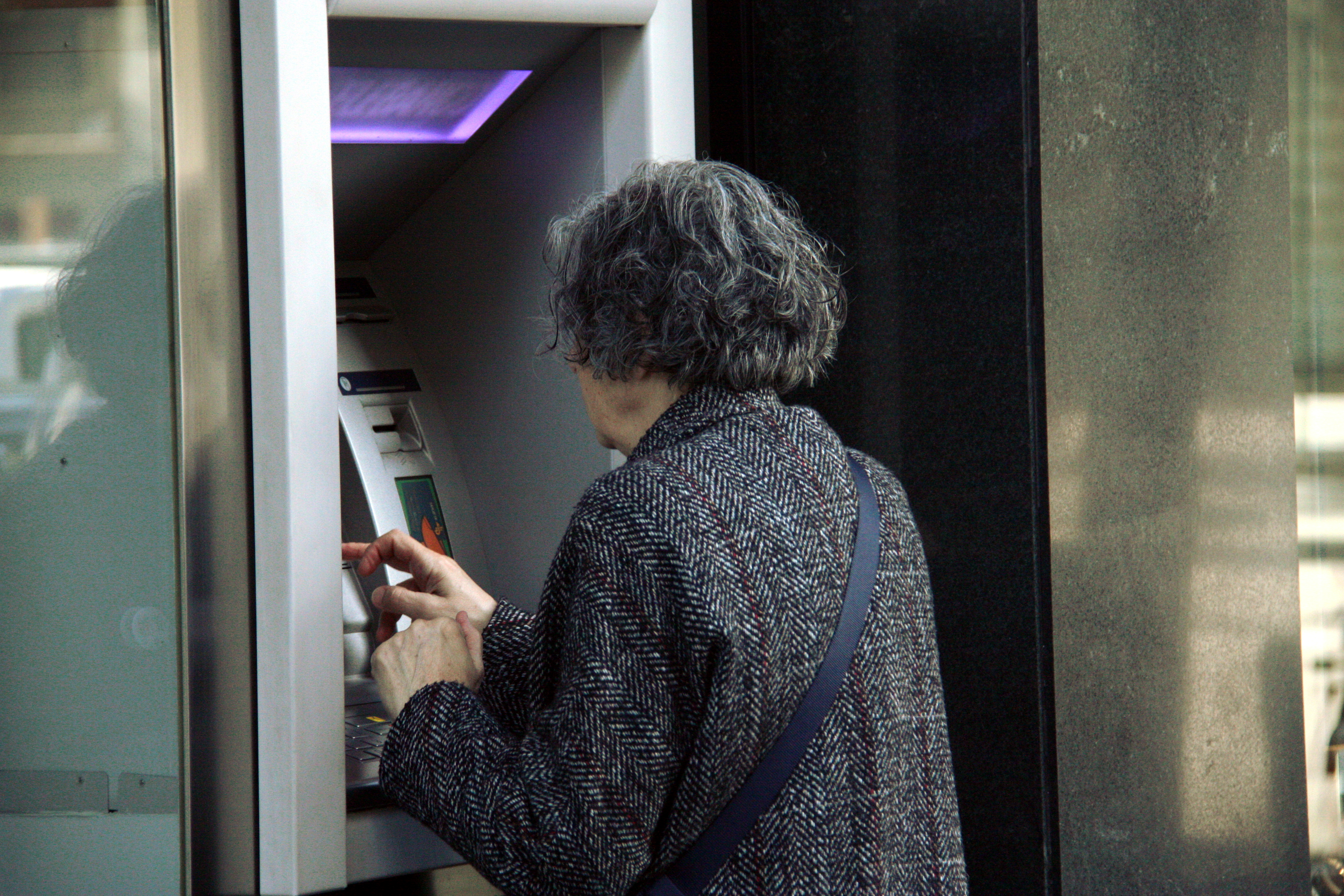 A customer using an ATM