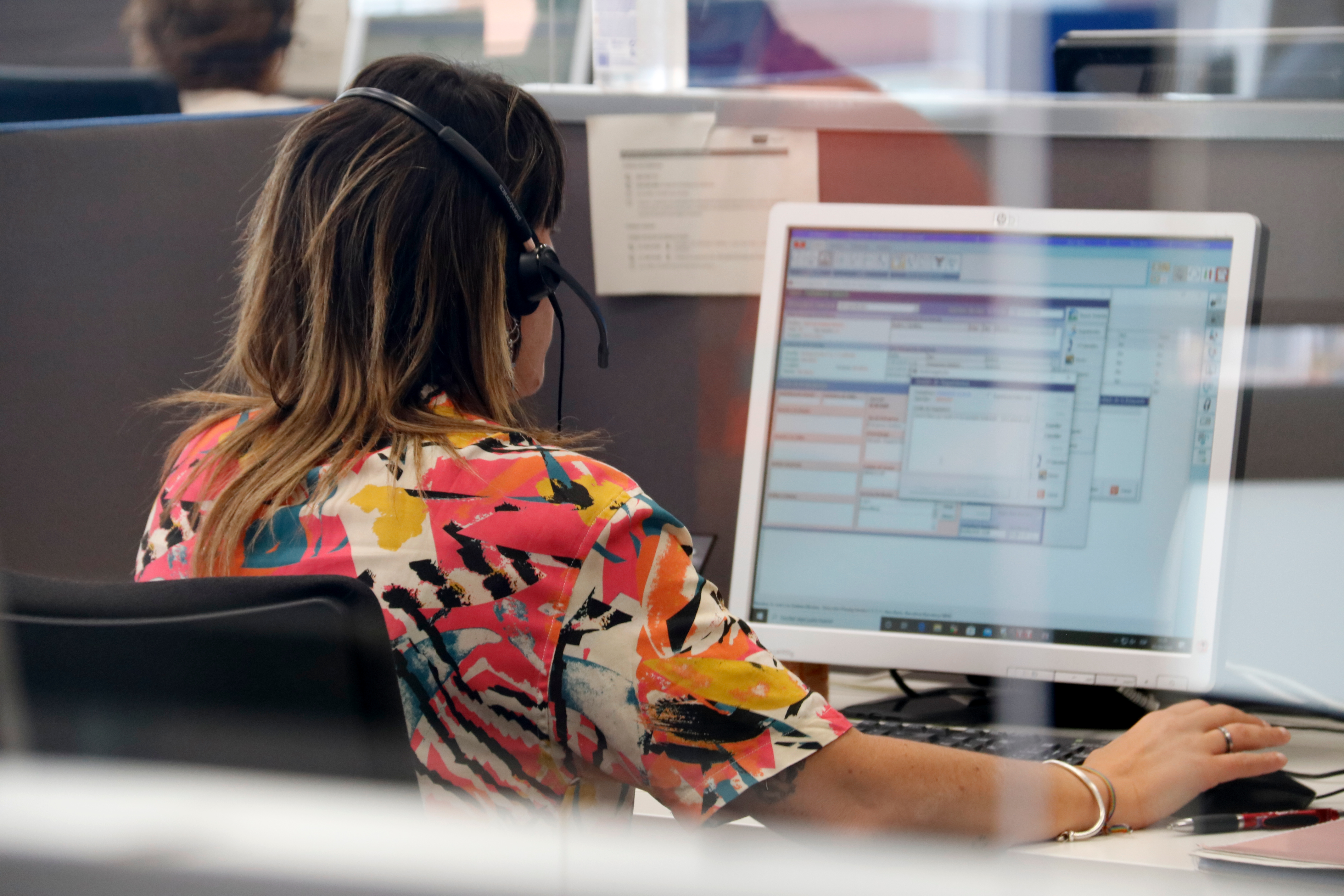 Stock image of a person working in a call center