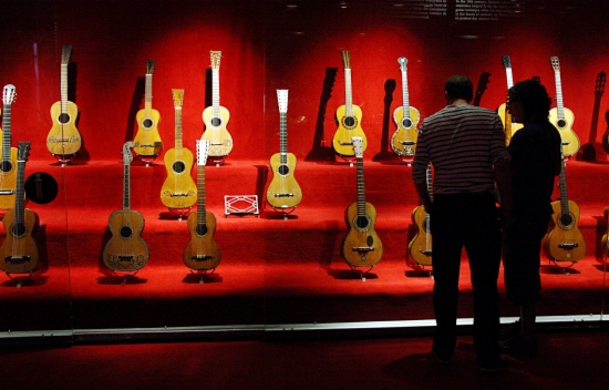 Visitors admire the guitar collection at the Museu de la Música, in Barcelona (by Pau Cortina)