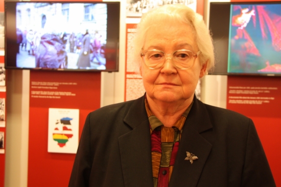 Gundega Michele in front of an exhibition about the 'Baltic Way' (by ACN)
