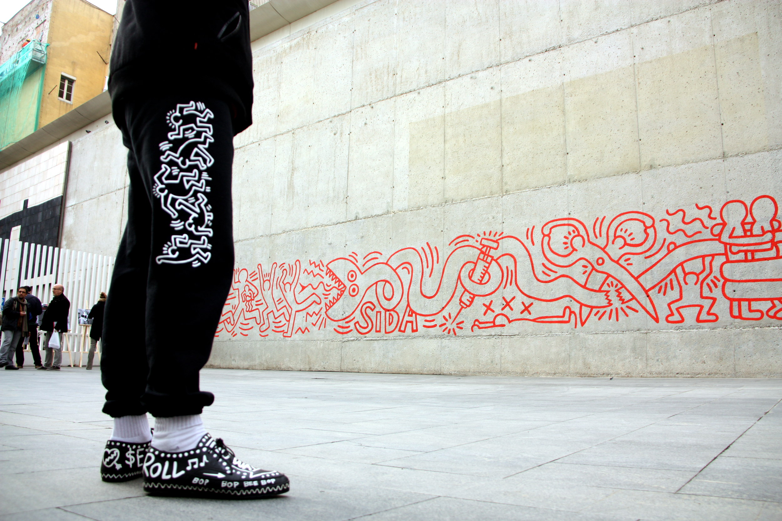 Urban artist Keith Haring chose the Raval neighbourhood in Barcelona to  execute his mural painting Together We Can Stop AIDS in 1989.