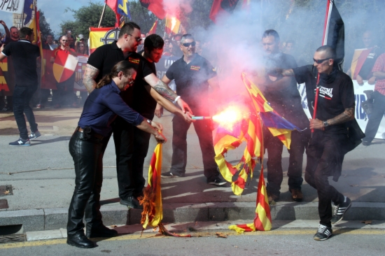 Fascists and Neo-Nazis burning Catalan independence flags on Spain's National Day in Barcelona (by J. Bataller)