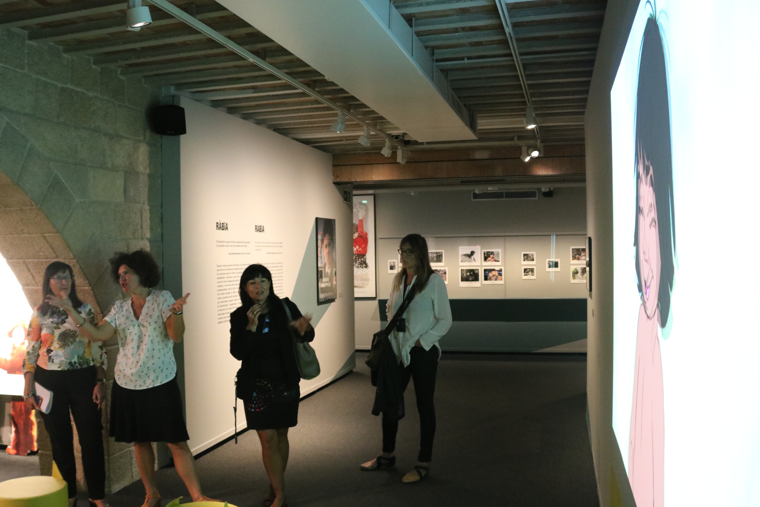 The 'Cinema and Emotions' exhibit at CaixaForum in Girona and some of its organizers (by ACN)