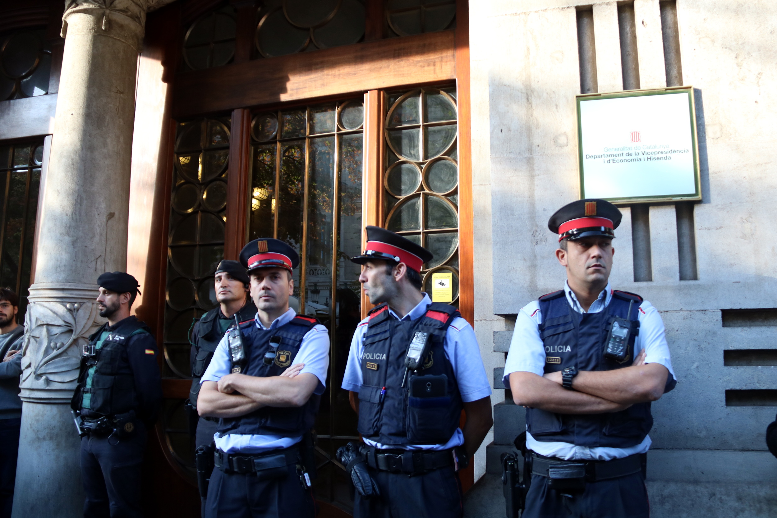 Some Catalan and Spanish police officers guarding Catalonia's department of Economy on Wednesday