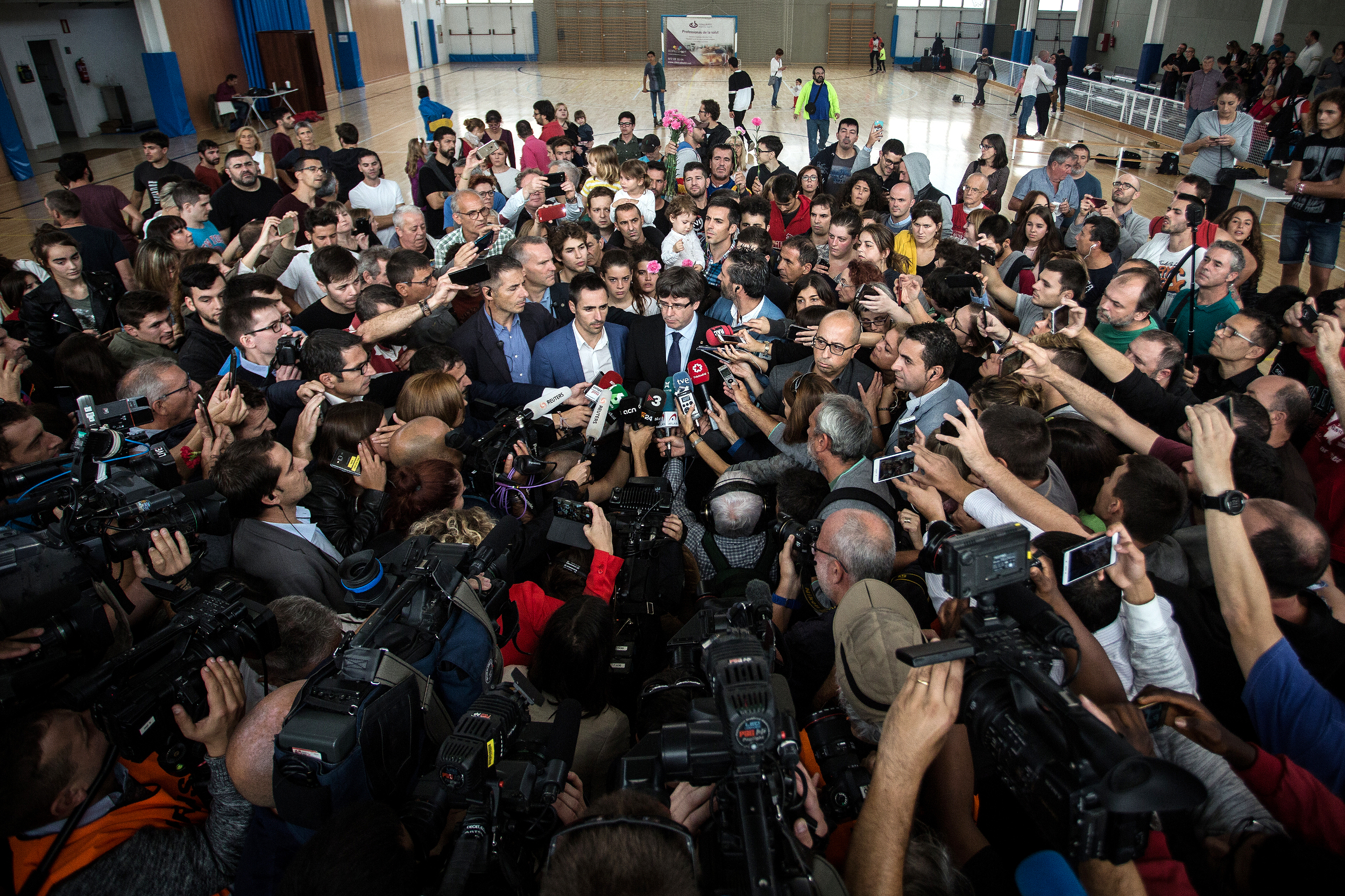 Catalan president Carles Puigdemont at a polling station on referendum day (by Carles Palacio)