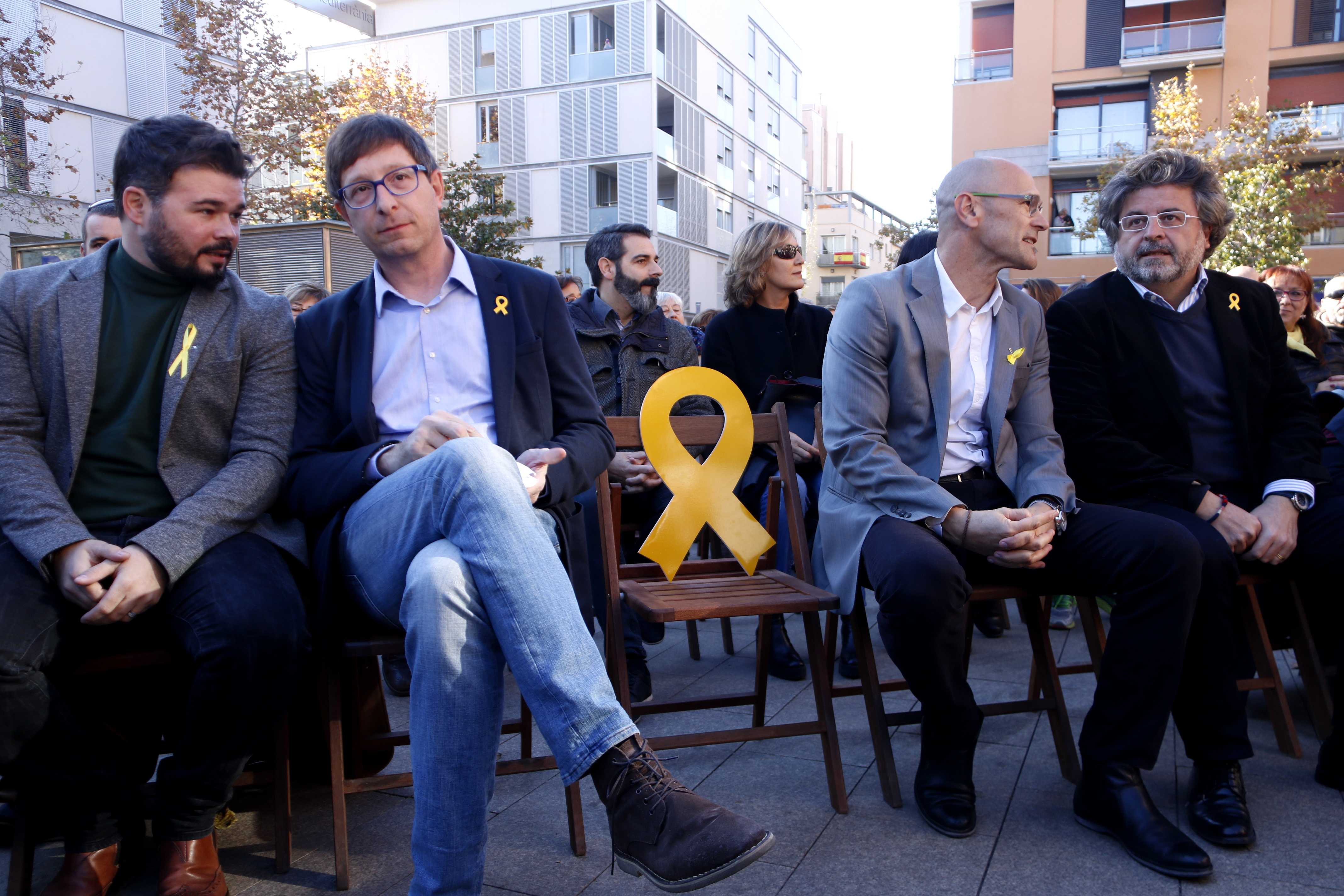 Gabriel Rufian, Carles Mundó, Raül Romeva and Antoni Castellà, with an empty seat for Oriol Junqueras,at an ERC meeting in the town Vilanova i la Geltrú on Devember 9 2017