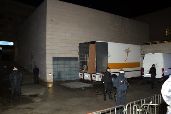 Some vehicles ready for the removal of artworks ouside Lleida museum