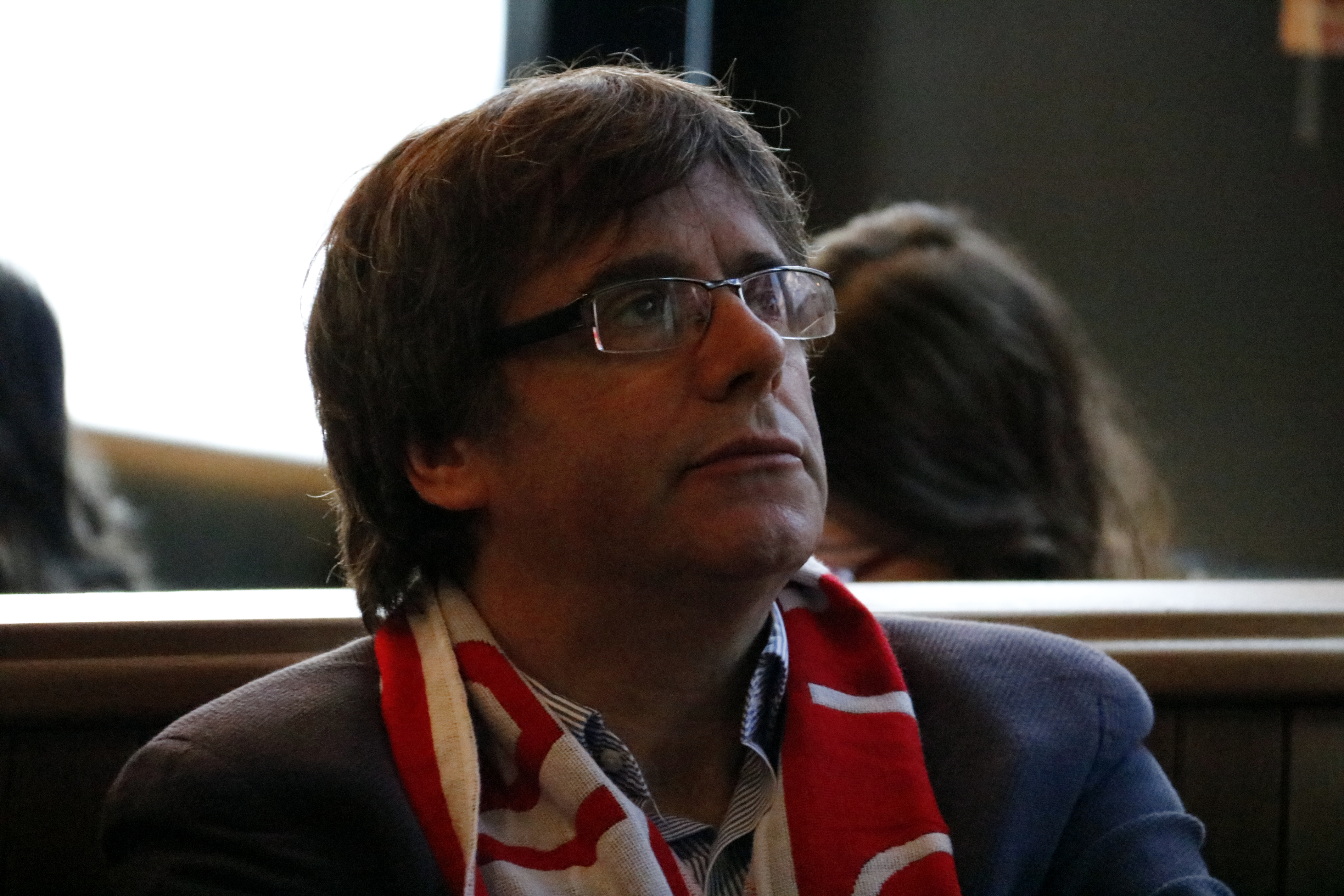 Carles Puigdemont watches the Girona football match from Brussels during the charity event where he gave away a signed Girona FC football jersey to raise money (by José Soler)