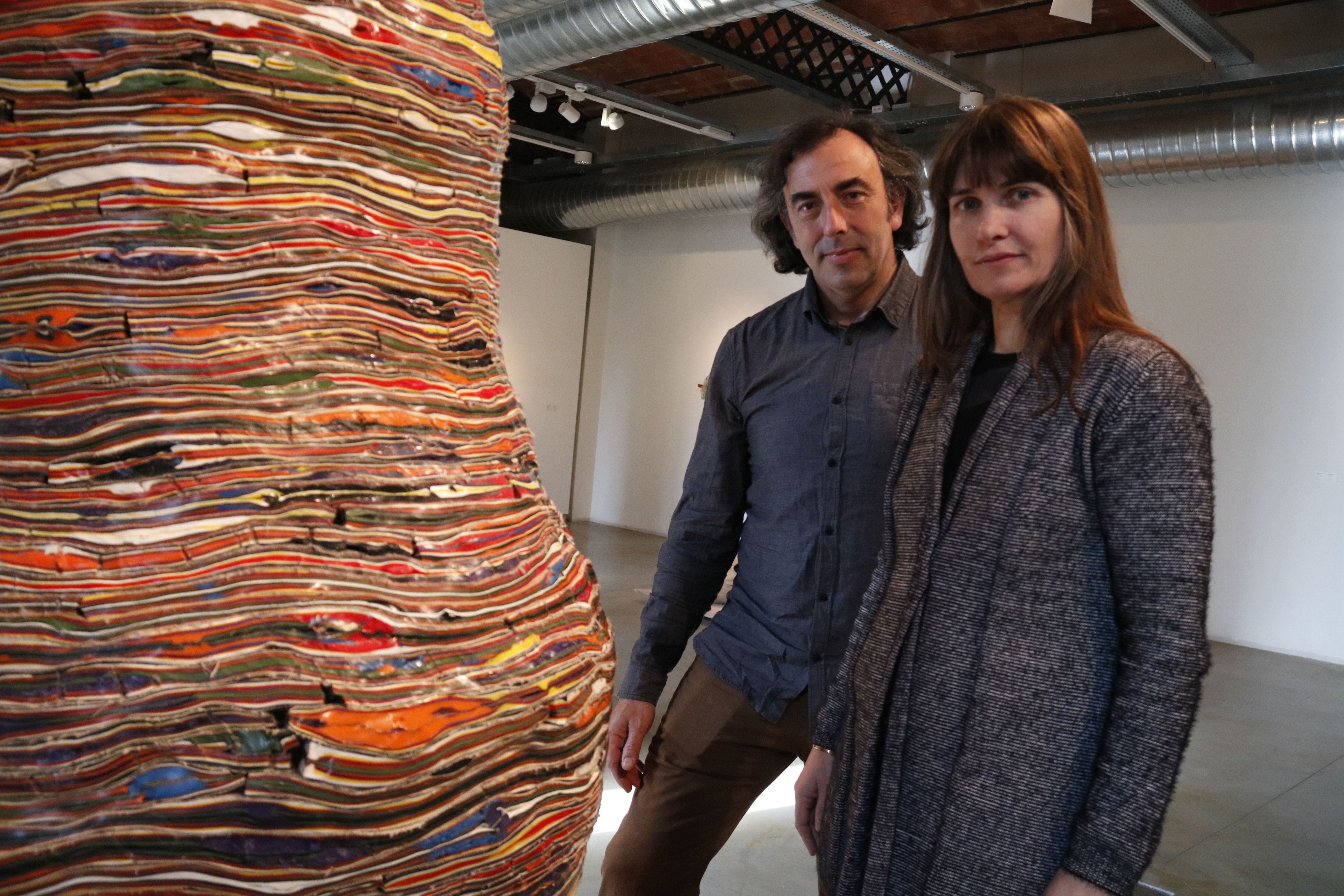 Xavier Escribà and Clarie Cayla stand next to one of Escribà's pieces on display at the Can Mario museum in Palafrugell (by Lourdes Casademont)