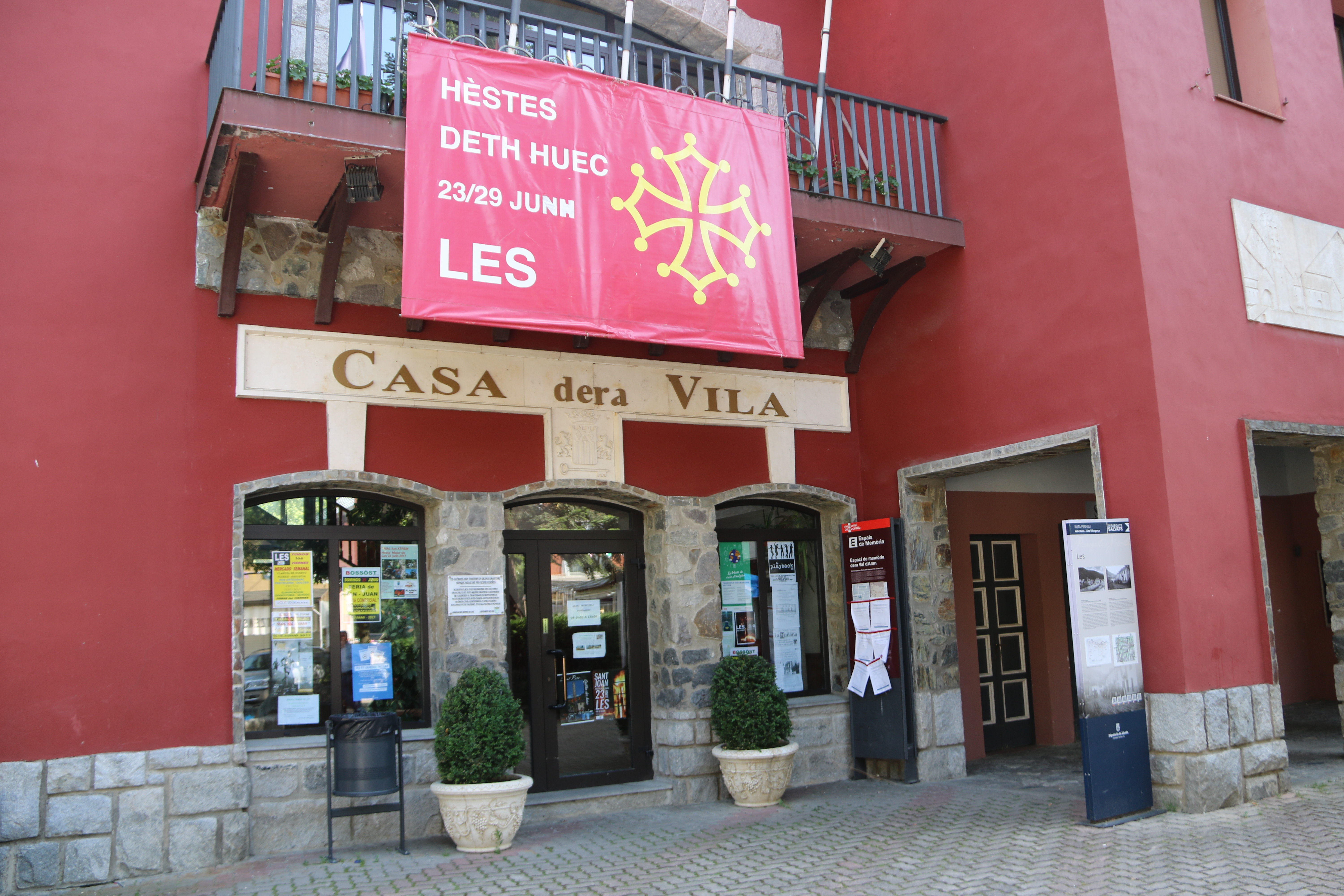 The town hall of Les, in the Val d'Aran, with a poster announcing the dates for a local celebration (by Marta Lluvich)