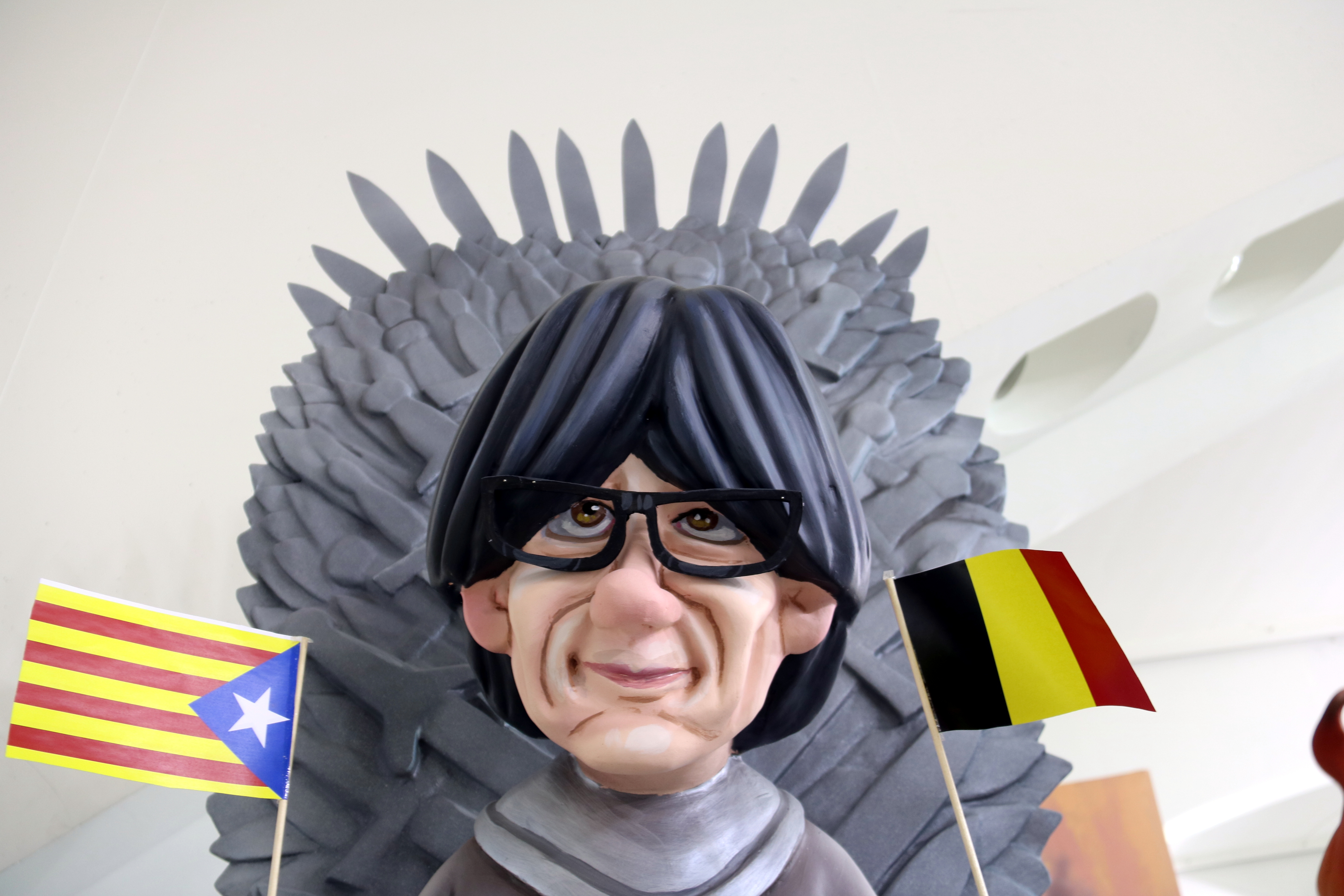 Carles Puigdemont depicted with a Belgian and Estelada (Catalan independence) flags and sitting on the Iron Throne from the Game of Thrones series in the Ninot de les Falles exhibit on February 3 2018 (by José Soler) 