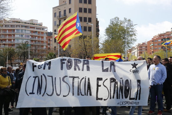 Members of CDR protesting with a banner reading 'Let’s get rid of Spanish injustice' in Caralan on April 9 2018 (by Selene Pernas)