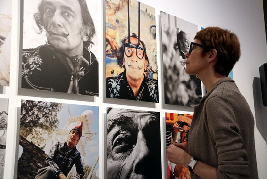 Director of Dalí Museums Montse Aguer looks at the exhibition and portraits of the artist on May 30 2018 (by Gemma Taubert)