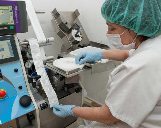 A woman dispensing drugs for Hepatitis C (by ACN)