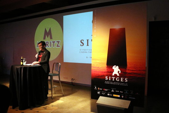 The director of the Sitges Film Festival, Àngel Sala, presents the upcoming event in front of the 2018 poster on June 6 2018 (by Pere Francesch)