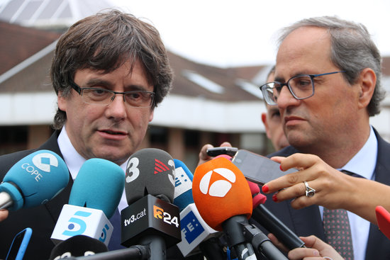The Catalan president, Quim Torra (right), with his predecessor, Carles Puigdemont in Waterloo on August 27, 2018 (by Natàlia Segura)