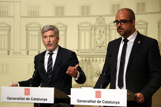 Catalonia's home affairs minister, Miquel Buch (right), and his Spanish counterpart, Fernando Grande-Marlaska (by Aina Martí)