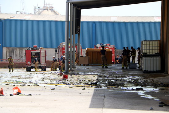 Aerosol cans and cleaning products scattered around the outside of the warehouse affected by the fire. (Photo: Mar Rovira)