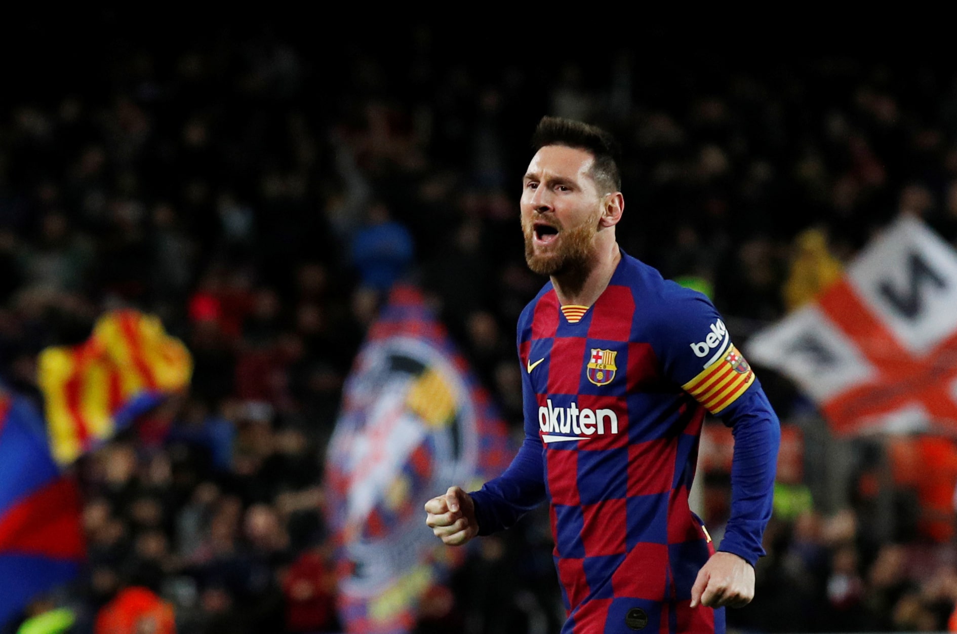 FC Barcelona captain Lionel Messi celebrates scoring one of his three goals in the La Liga match against Celta Vigo (by REUTERS/Albert Gea)