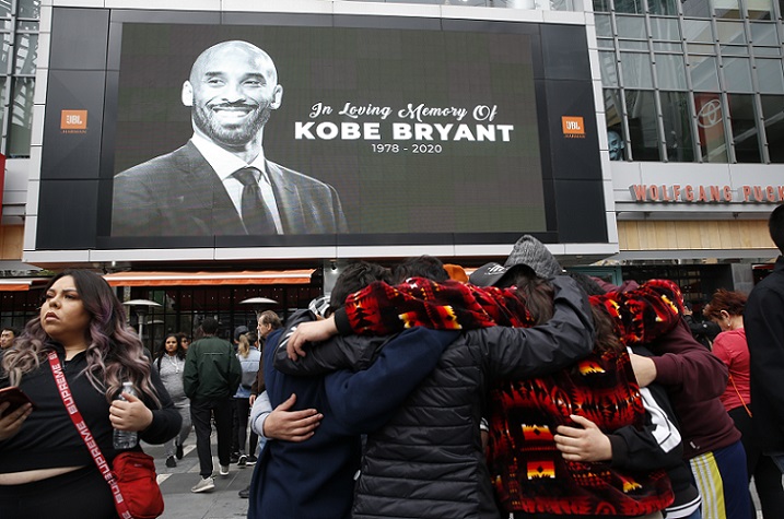 Image of late NBA superstar Kobe Bryant projected outside Staples Center, in Los Angeles (by Monica Almeida/Reuters)