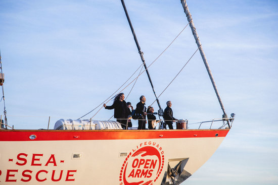 Members of the band Sopa de Cabra standing on the Open Arms Sea Rescue ship (by Gemma Martz)