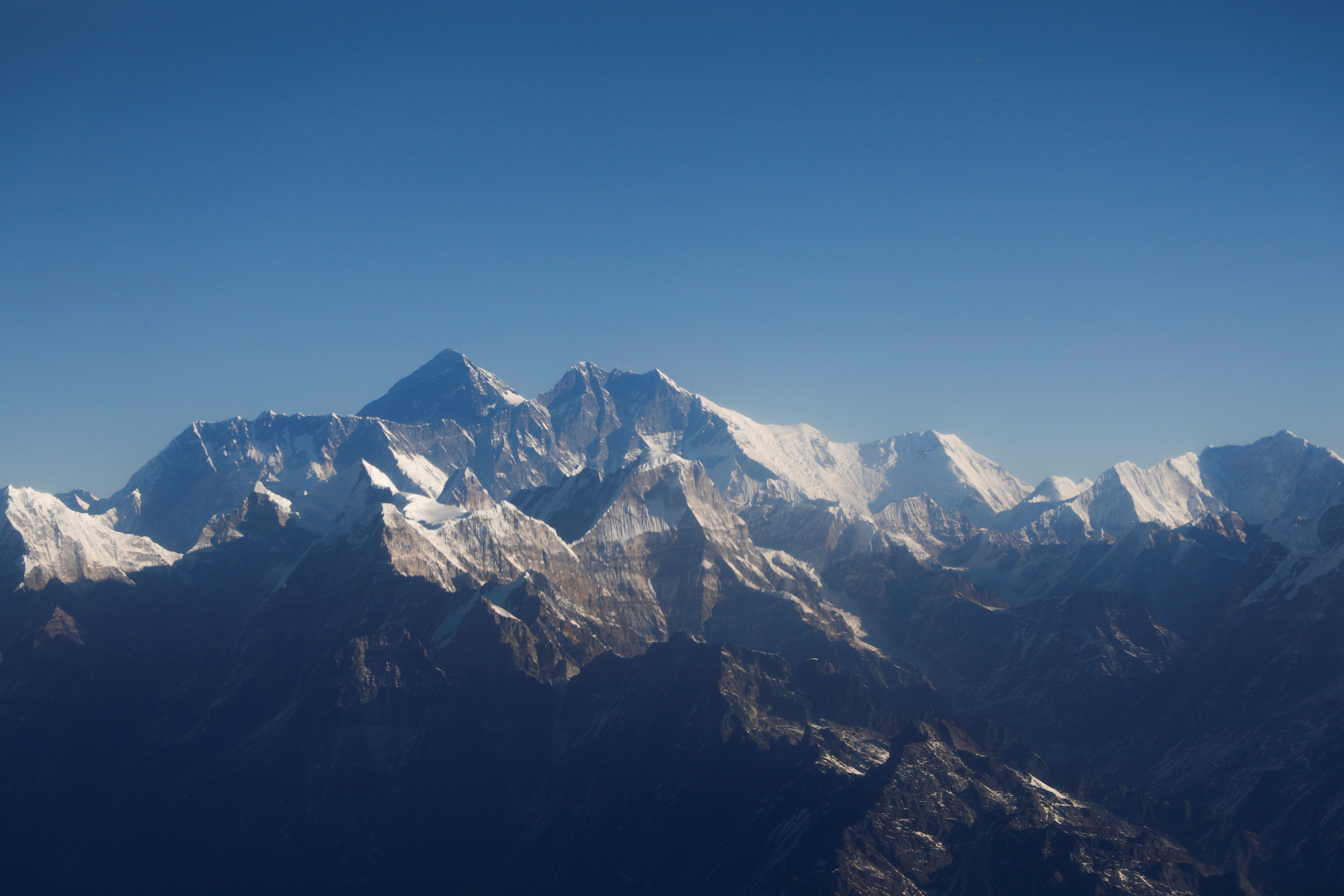Mount Everest, the world's highest peak, and other peaks of the Himalayan range are seen through an aircraft window during a mountain flight from Kathmandu, January 15, 2020 (by Reuters/Monika Deupala)