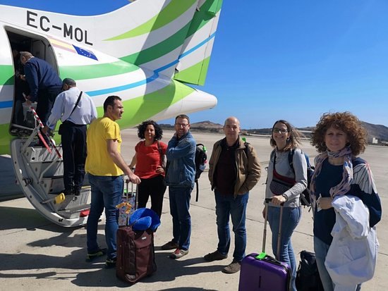 Members of the working group for peace and freedom in the Sahara in front of the plane which they took to Morocca, where they were denied entry by the Moroccan government (by CUP)