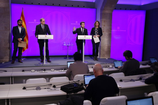 President Quim Torra, vice president Pere Aragonès, and ministers Àngels Chacon and Chakir El Homrani during the government's press conference announcing new measures to mitigate the impact of the coronavirus (by Sílvia Jardí)