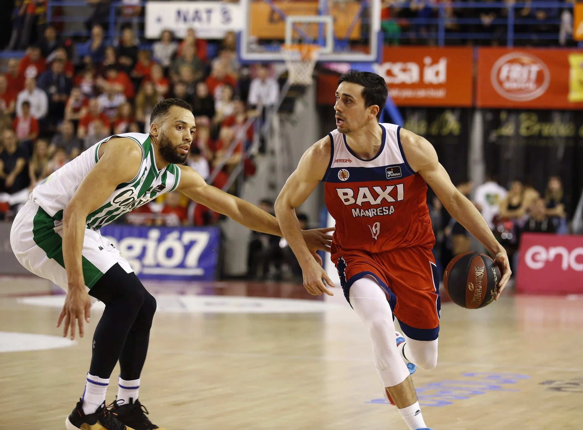 Pere Tomàs (right) in action against Real Betis in the Liga ACB, Spain's top professional basketball league (image from Bàsquet Manresa)