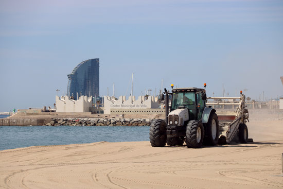 Bogatell beach in Barcelona being cleaned the day before it is reopened to the public during the coronavirus crisis in May, 2020 (by Miquel Codolar)