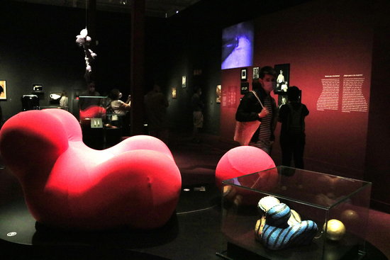 Visitors look at one of the pieces on display at the Caixa Forum in their exhibition 'Objects of desire. Surrealism and design, 1924-2020' (by Laura Fíguls)