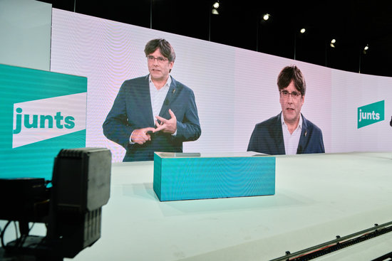 Carles Puigdemont appears via video link at the formation of Junts per Catalunya as a political party (by JxCat)