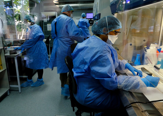 Researchers studying a vaccine in a laboratory run by South African biotechnology company TASK in Cape Town, South Africa, May 11, 2020 (REUTERS/Mike Hutchings)