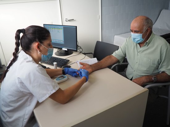A doctor checking a patient at a medical center in Salt