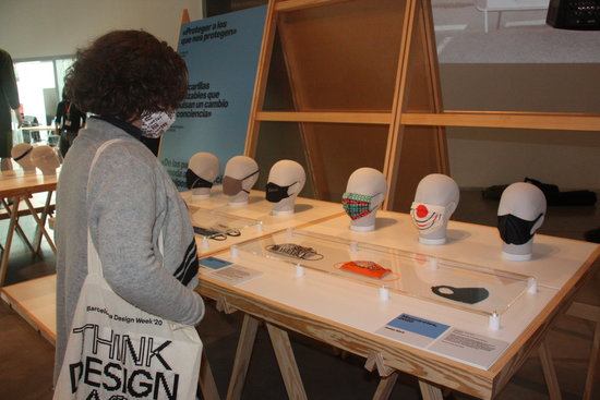 A woman looks at some of the masks on display at the 'Emergency! Designs against Covid-19' exhibition at the Barcelona Design Museum, November 17, 2020 (by Maria Asmarat) 