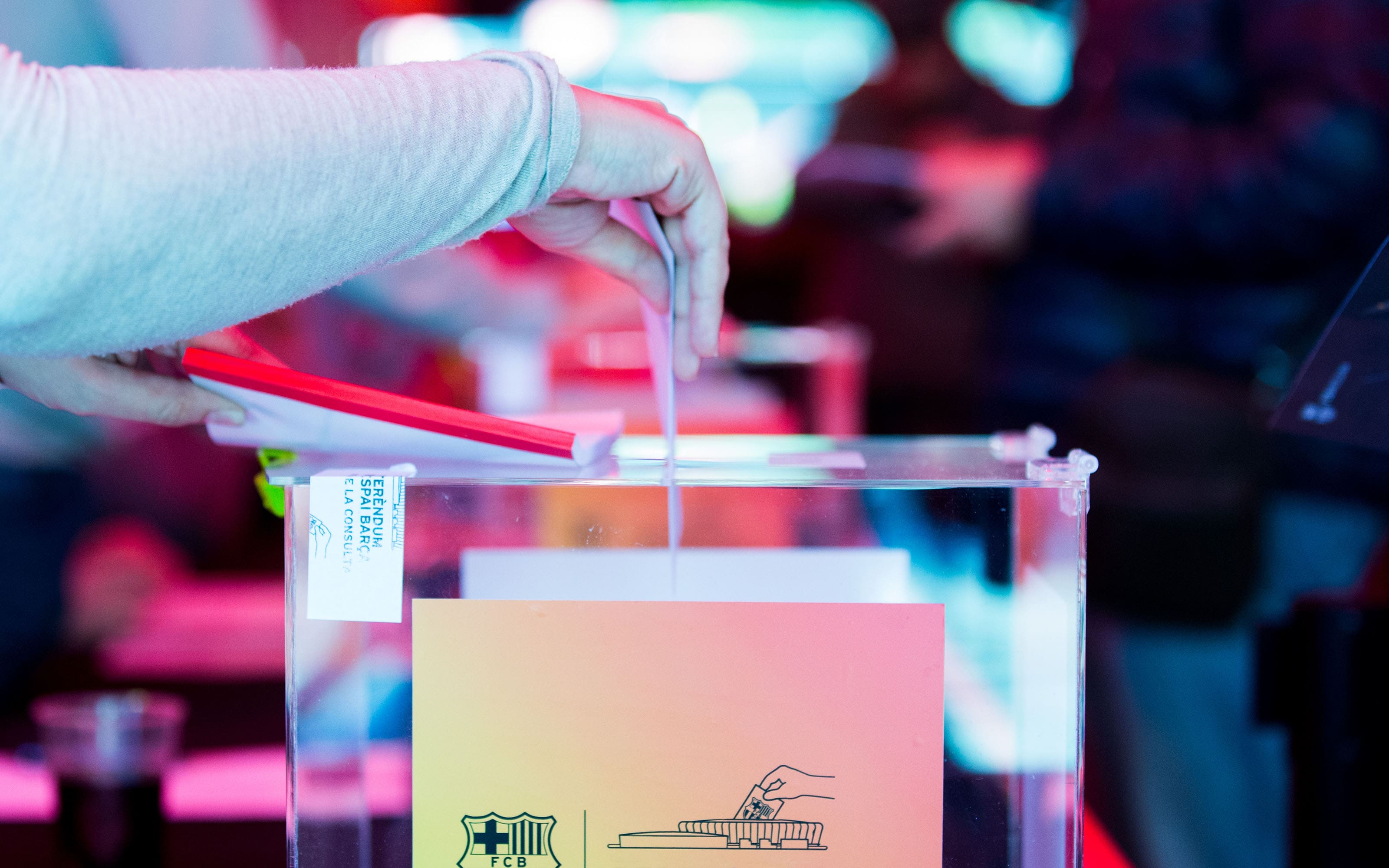 A ballot being placed into a box from a past FC Barcelona presidential election (image from FC Barcelona website)
