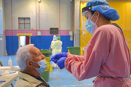 A medical professional tests a man for Covid-19 in Olot, northern Catalonia (image courtesy of Olot council)
