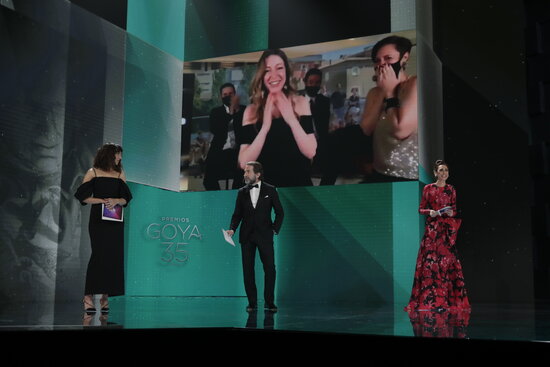 On the screen, Pilar Palomero after receiving the Best New Director award at the Goya's gala (by Spain's Film Academy)