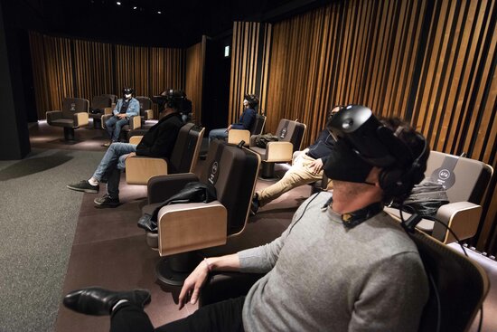 Spectators try on the VR headsets and enjoy the production 'Symphony' in Barcelona's CaixaForum (image from CaixaForum Barcelona)