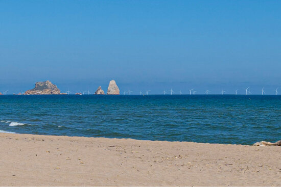 An impression of how the Parc Tramuntana wind turbines may appear when viewed from the seaside town of L'Estartit